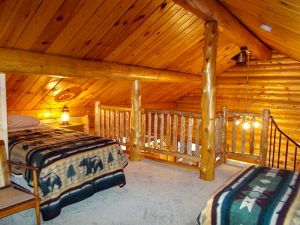 Cedar Point Log Cabin loft space with multiple beds
